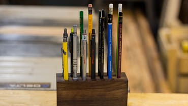Pencil holder made from a block of walnut