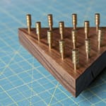 IQ Puzzle made out of walnut with brass pegs