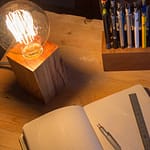 Wood desk lamp made from recycled materials.