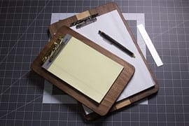 A walnut and maple clipboard made from scrap wood.