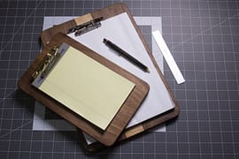 A walnut and maple clipboard made from scrap wood.