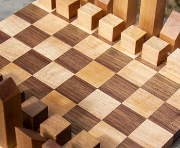 Modern wooden chessboard made from maple and walnut