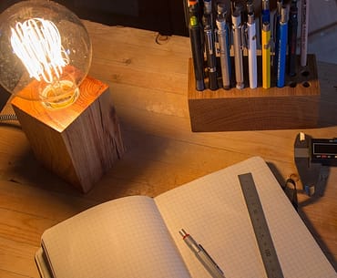 Wood desk lamp made from recycled materials.