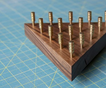 IQ Puzzle made out of walnut with brass pegs
